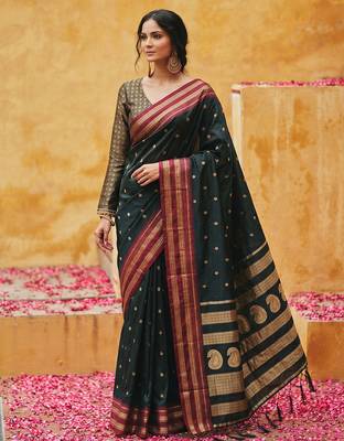 the midnight luxurious black soft silk blend saree with magenta & gold zari border 1