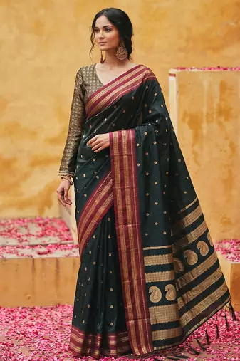 the midnight luxurious black soft silk blend saree with magenta & gold zari border