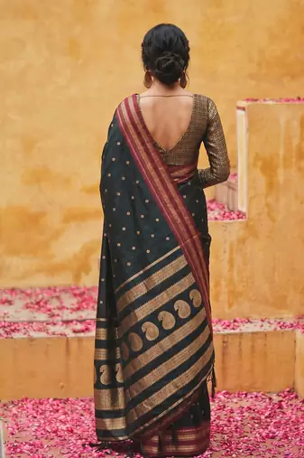 the midnight luxurious black soft silk blend saree with magenta & gold zari border