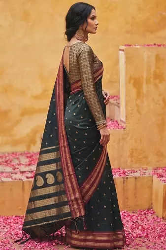 the midnight luxurious black soft silk blend saree with magenta & gold zari border