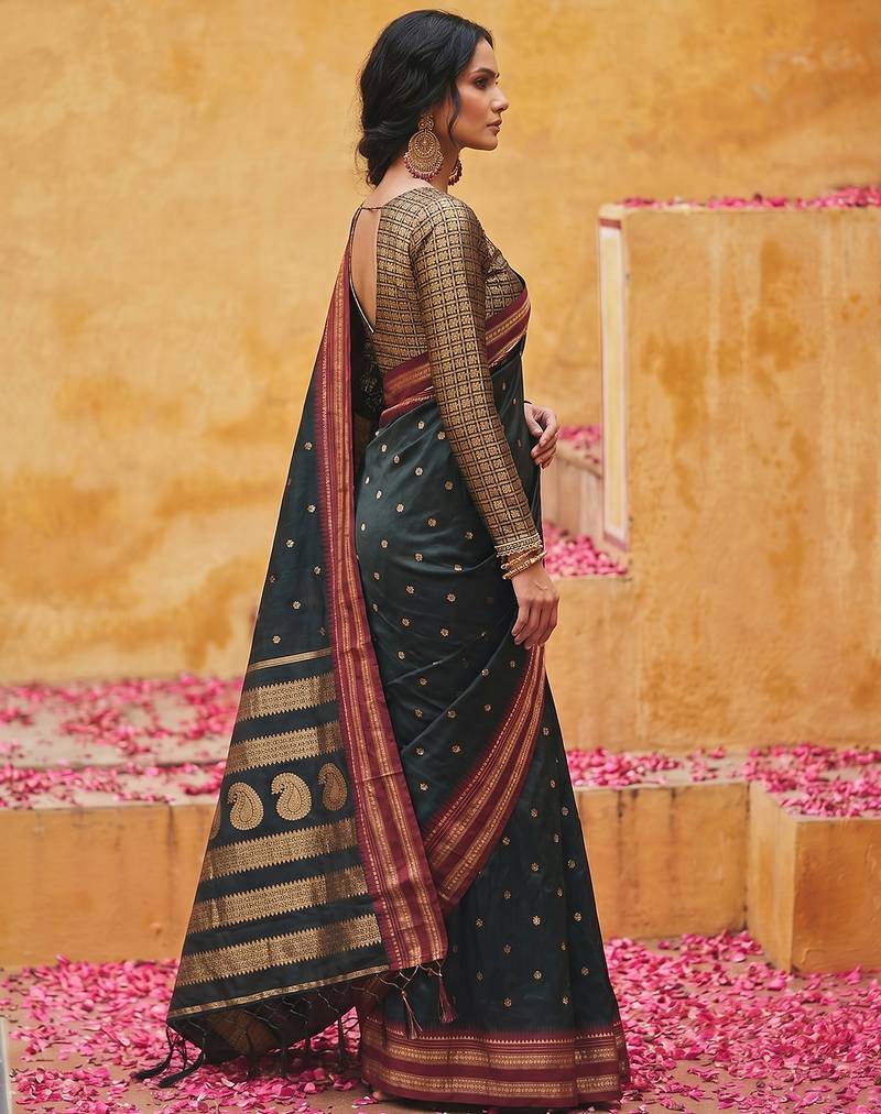 the midnight luxurious black soft silk blend saree with magenta & gold zari border