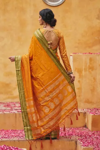 the sunset glow: vibrant orange soft silk blend saree with contrast green zari border