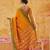the sunset glow: vibrant orange soft silk blend saree with contrast green zari border