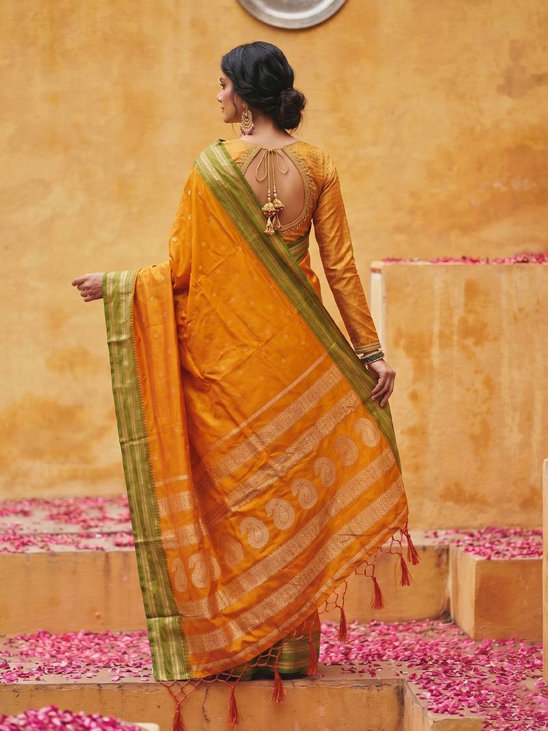 the sunset glow: vibrant orange soft silk blend saree with contrast green zari border