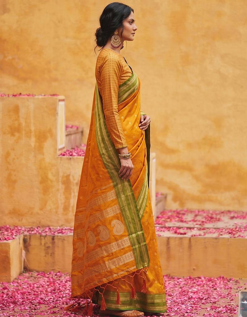 the sunset glow: vibrant orange soft silk blend saree with contrast green zari border