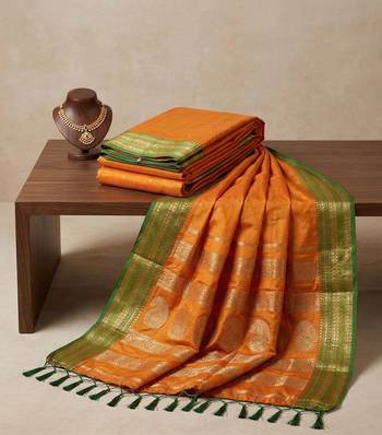 the sunset glow: vibrant orange soft silk blend saree with contrast green zari border 4