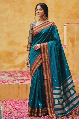 the peacock hue: teal blue soft silk blend saree with contrast red zari border