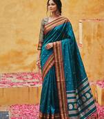 the peacock hue: teal blue soft silk blend saree with contrast red zari border
