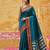 the peacock hue: teal blue soft silk blend saree with contrast red zari border