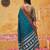 the peacock hue: teal blue soft silk blend saree with contrast red zari border