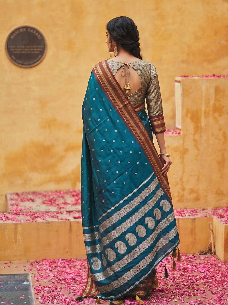 the peacock hue: teal blue soft silk blend saree with contrast red zari border