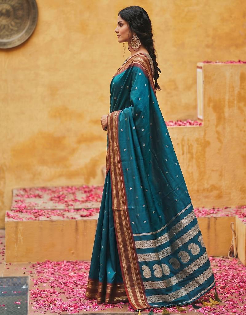 the peacock hue: teal blue soft silk blend saree with contrast red zari border