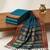 the peacock hue: teal blue soft silk blend saree with contrast red zari border