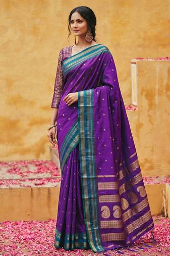 the violet soft silk blend saree with contrast green zari border