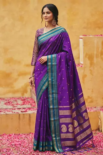 the violet soft silk blend saree with contrast green zari border