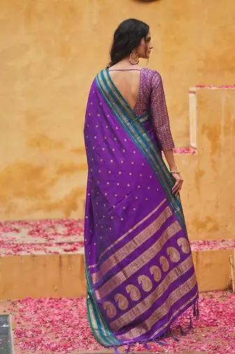 the violet soft silk blend saree with contrast green zari border