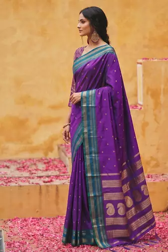 the violet soft silk blend saree with contrast green zari border