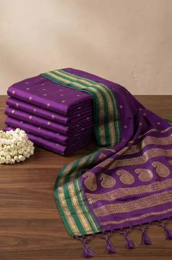 the violet soft silk blend saree with contrast green zari border