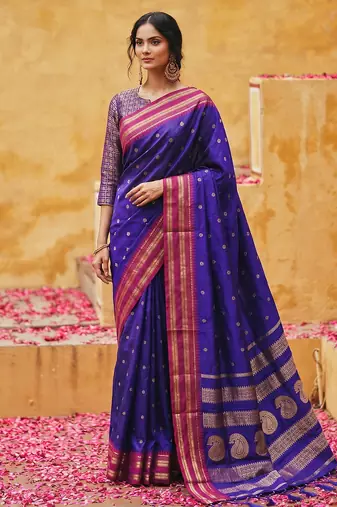 the blue soft silk blend saree with contrast red zari border