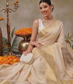 Beige plain silk blend ethnic saree with blouse piece