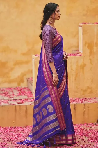 the blue soft silk blend saree with contrast red zari border