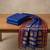 the blue soft silk blend saree with contrast red zari border