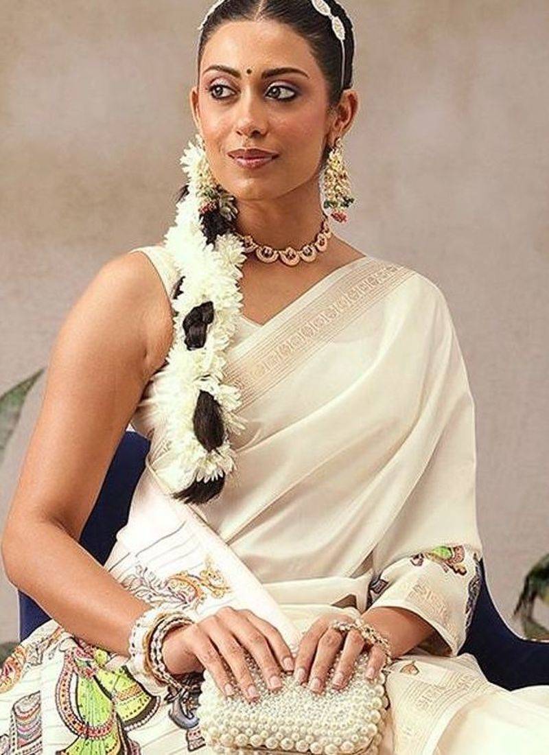 Off white printed art silk ethnic saree with blouse piece