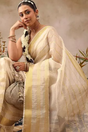 Off white woven silk blend ethnic saree with blouse piece