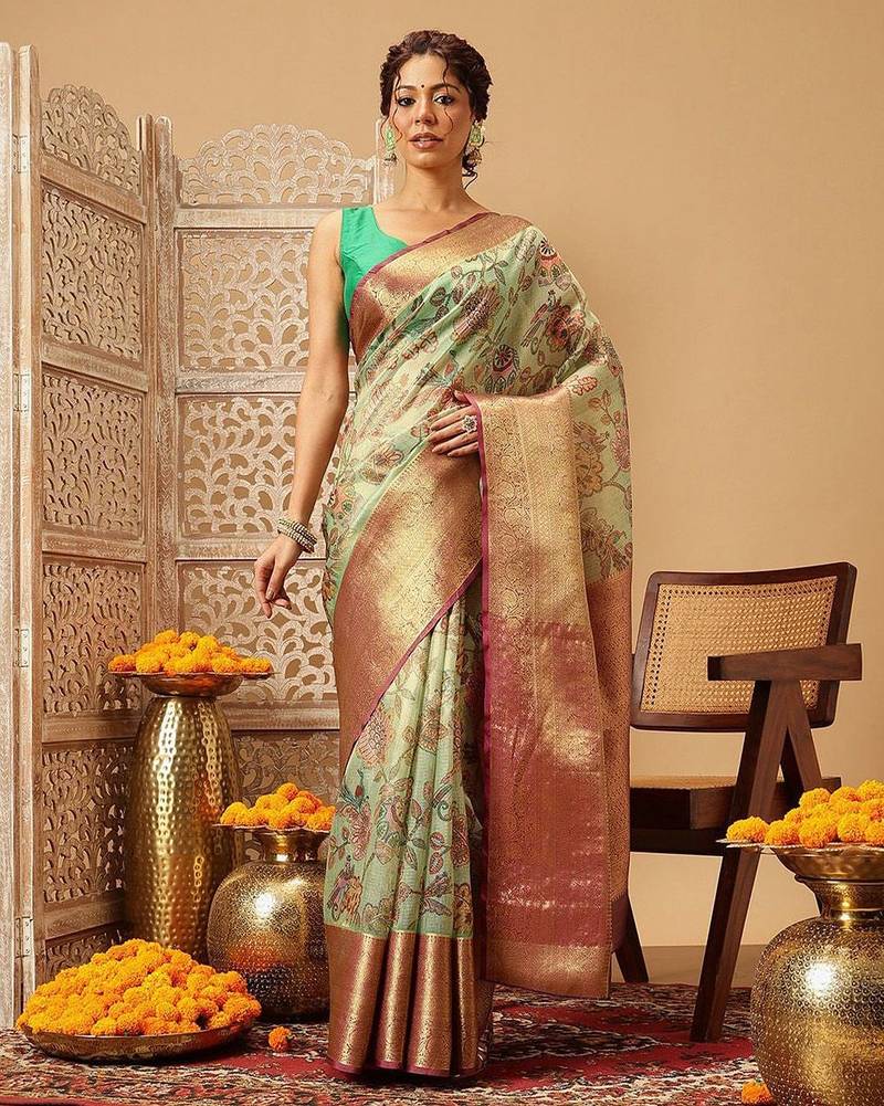 Green printed silk blend ethnic saree with blouse piece