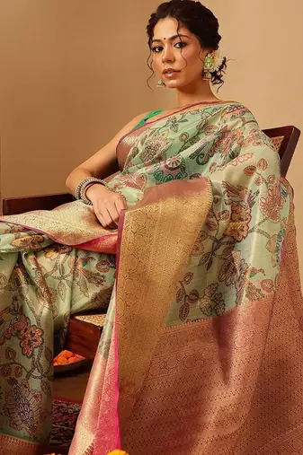 Green printed silk blend ethnic saree with blouse piece