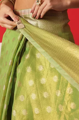 Lime woven tissue party wear saree with blouse piece