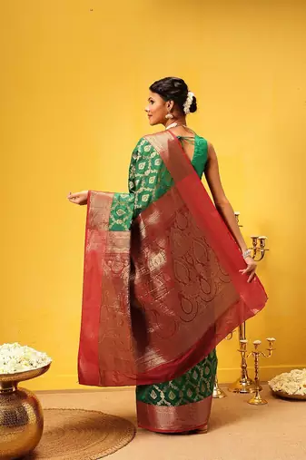 Green woven silk blend ethnic saree with blouse piece