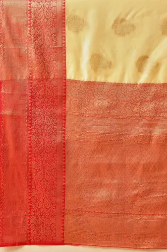 Cream woven art silk traditional saree with blouse piece
