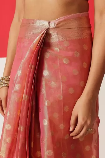 Pink woven tissue party wear saree with blouse piece