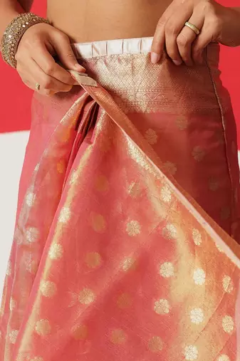 Pink woven tissue party wear saree with blouse piece