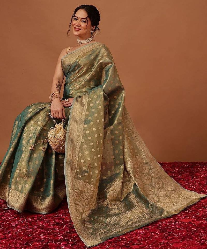 Teal woven tissue party wear saree with blouse piece