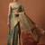 Teal woven tissue party wear saree with blouse piece