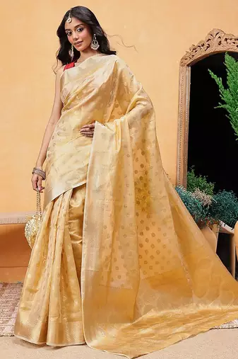 Beige woven tissue party wear saree with blouse piece