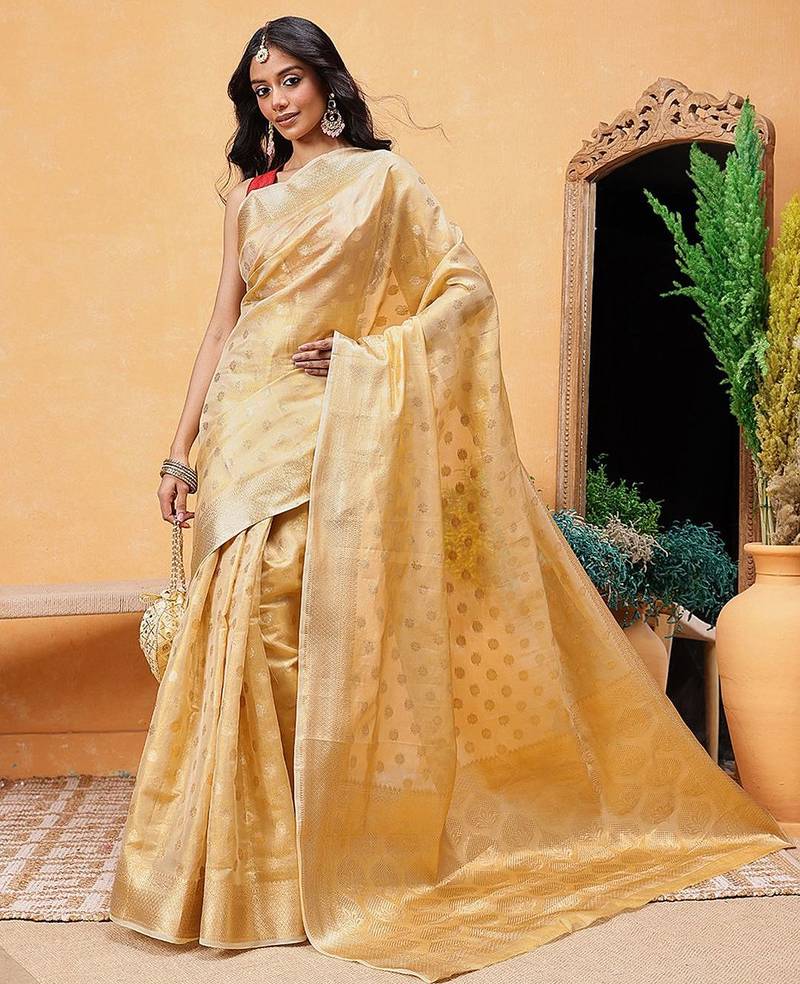 Beige woven tissue party wear saree with blouse piece