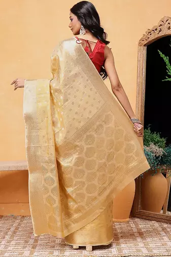 Beige woven tissue party wear saree with blouse piece