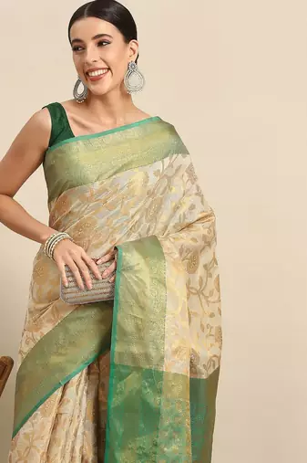 Green woven tissue party wear saree with blouse piece