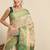 Green woven tissue party wear saree with blouse piece