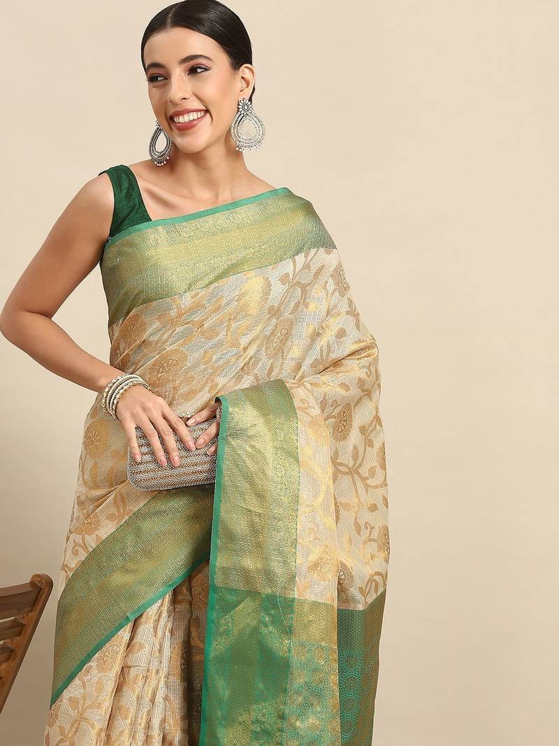 Green woven tissue party wear saree with blouse piece