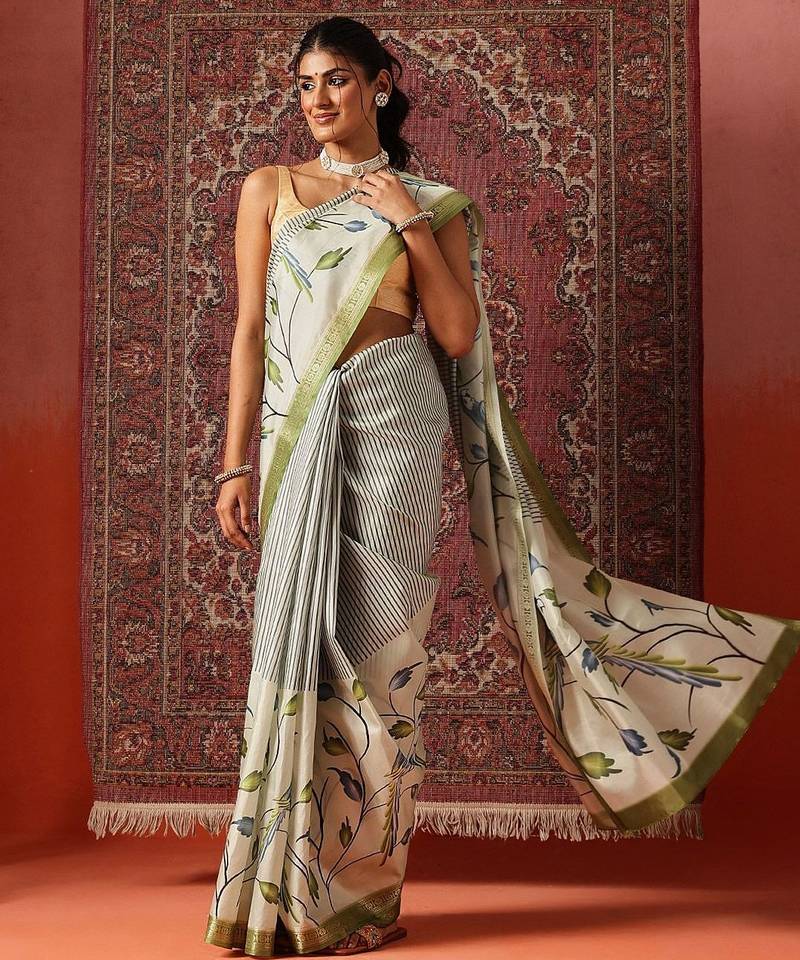 Off white printed art silk ethnic saree with blouse piece