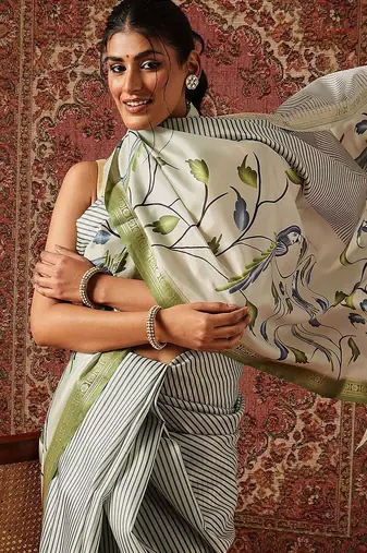 Off white printed art silk ethnic saree with blouse piece