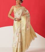 Cream printed tissue traditional saree with blouse piece
