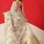 Cream printed tissue traditional saree with blouse piece
