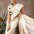 Off white woven silk blend ethnic saree with blouse piece