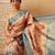 Peach printed tissue traditional saree with blouse piece