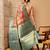 Peach printed tissue traditional saree with blouse piece